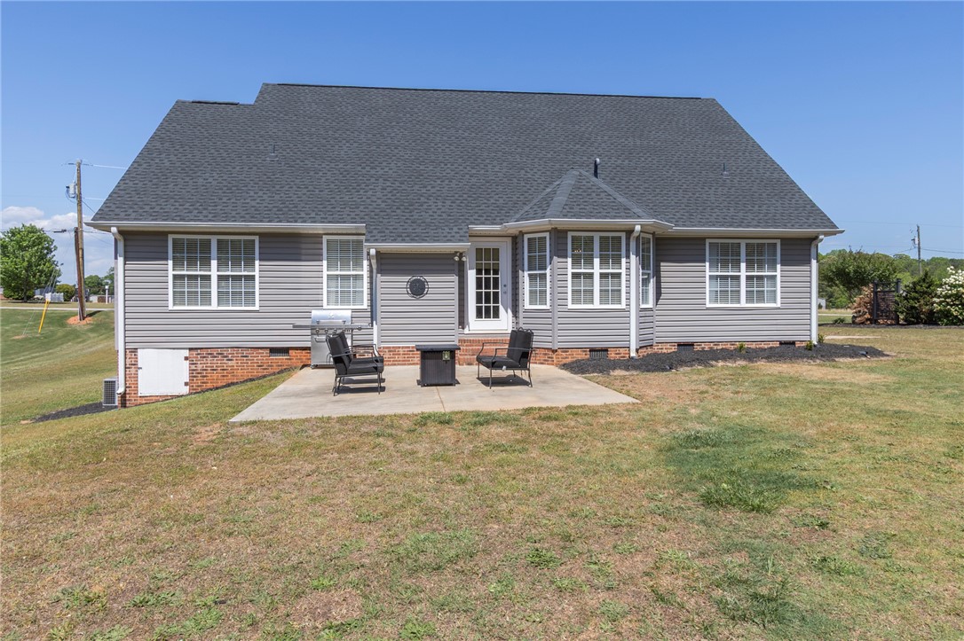 208 Mahaffey Road Williamston, SC 29697 - Photo 39 of 44 This charming home offers a serene outdoor space with a comfortable patio, perfect for relaxing.
