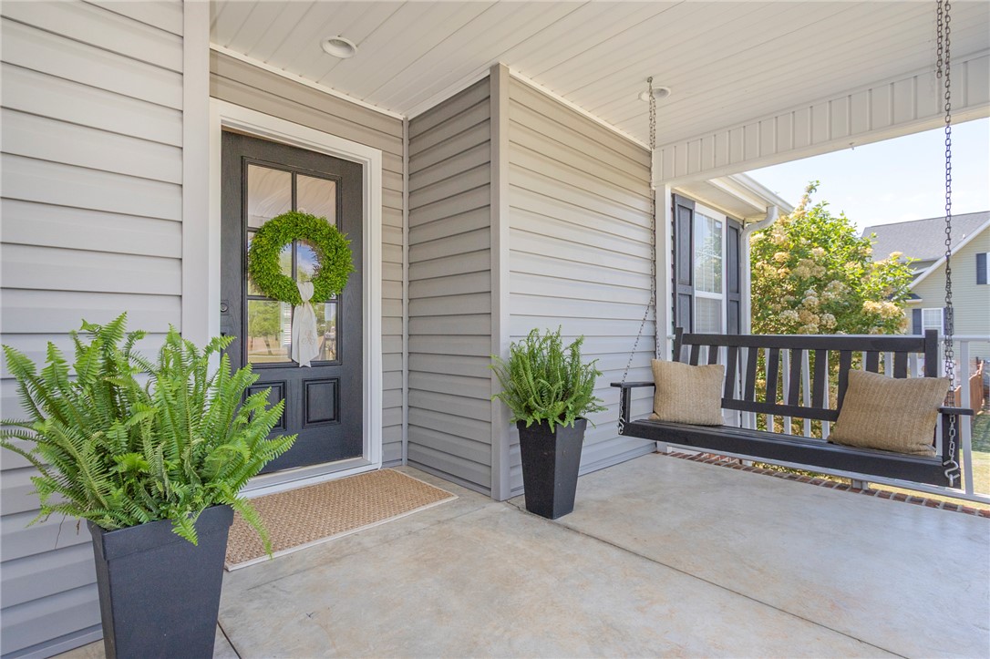 208 Mahaffey Road Williamston, SC 29697 - Photo 4 of 44 This inviting covered porch features ample space for relaxation and welcoming guests.