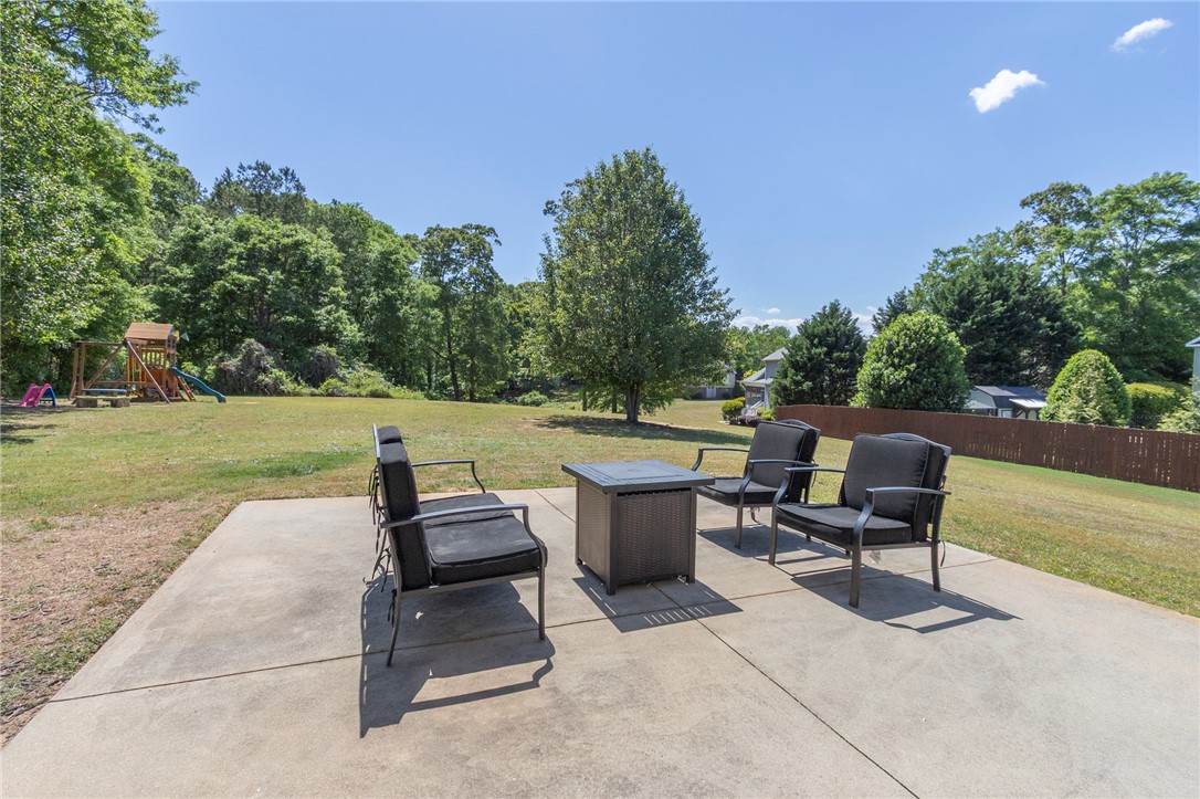 208 Mahaffey Road Williamston, SC 29697 - Photo 41 of 44 Enjoy outdoor living on this expansive patio, perfect for relaxation and entertaining.
