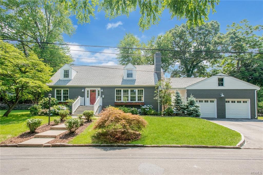 3 Greenvale Place Scarsdale, NY 10583 - Photo 1 of 1 a front view of a house with a garden