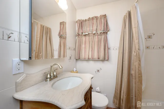 a bathroom with sink and a mirror