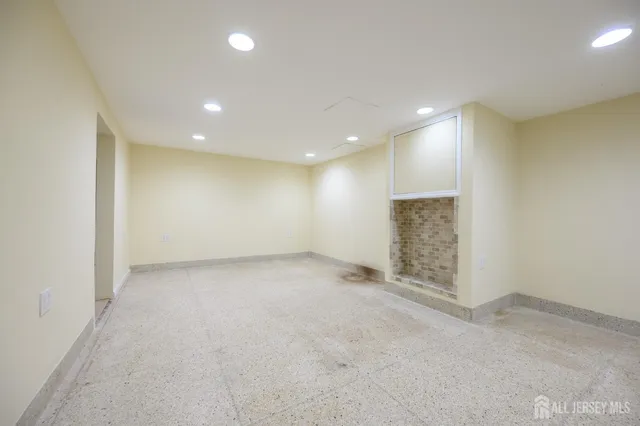 an empty room with a empty space and a window