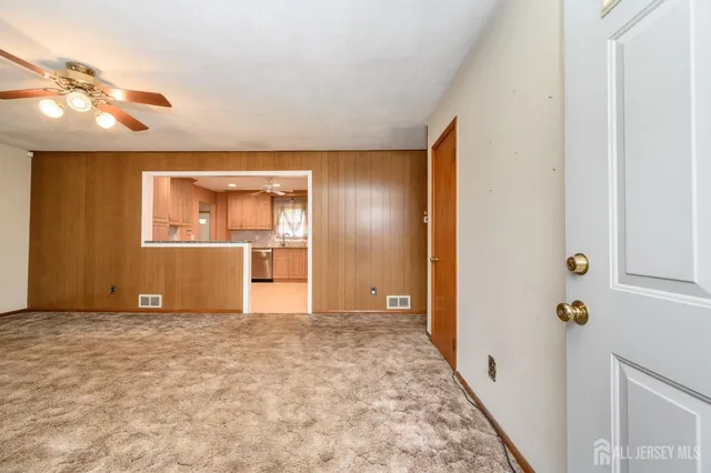 a view of an empty room with a bathroom