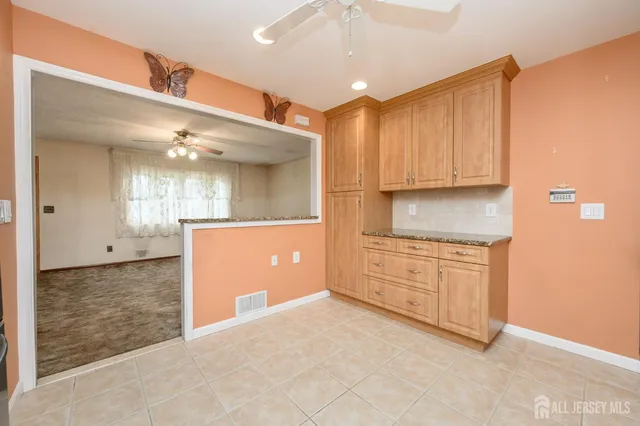 a view of a kitchen with cabinets appliances