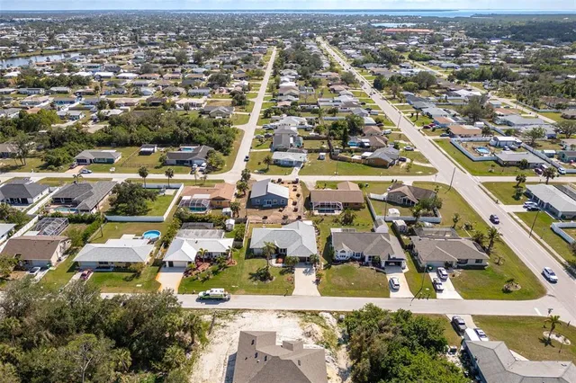 an aerial view of residential houses with city view