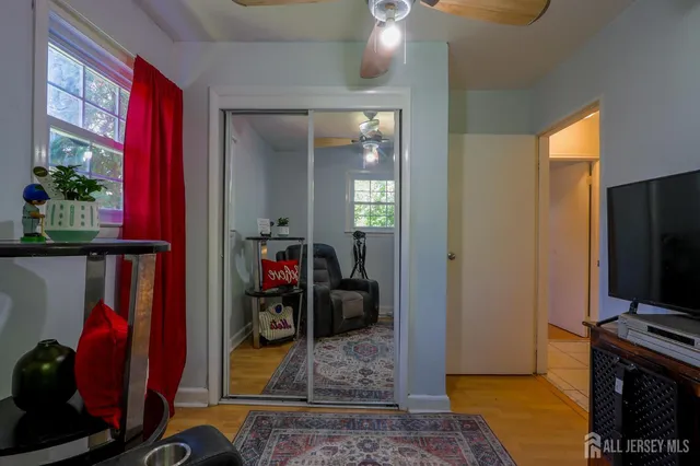 a view of a livingroom with furniture and a flat screen tv