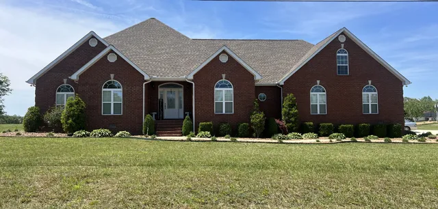 front view of a house with a yard
