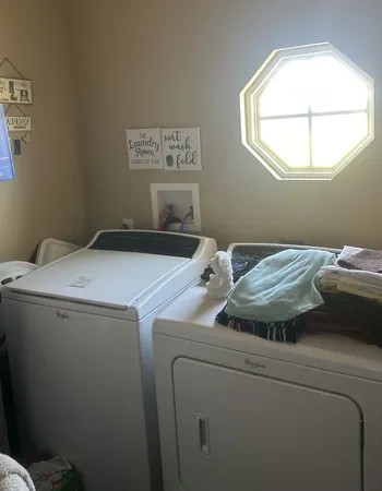 a utility room with dryer and washer