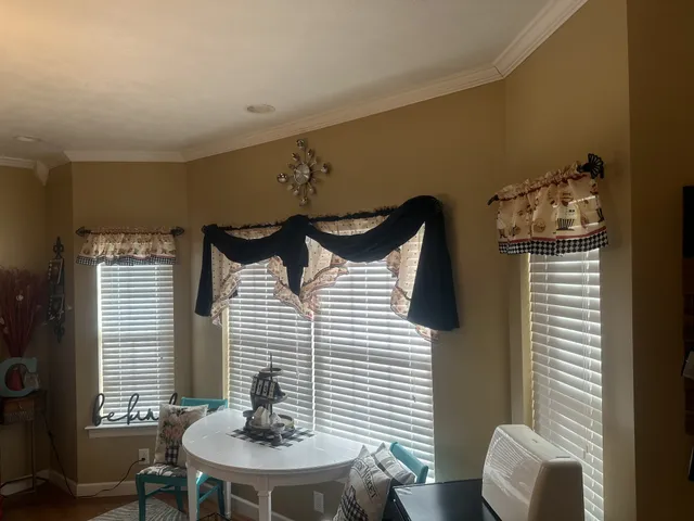 a dining room with furniture and window