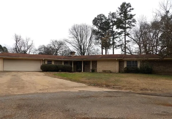 a house with trees in the background