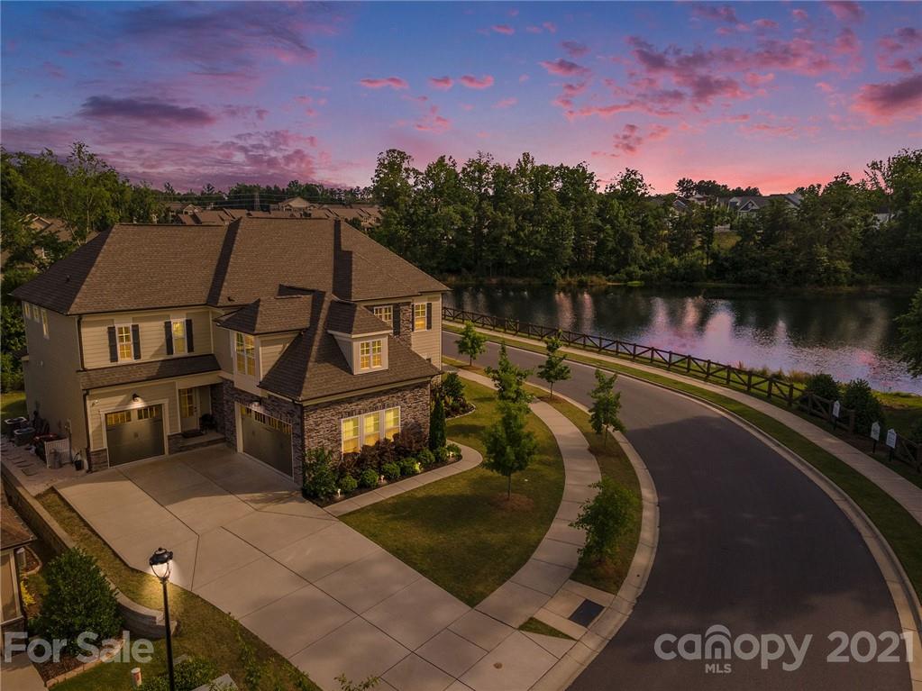 1342 Afton Way Fort Mill, SC 29708 - Photo 1 of 40 a view of a lake with a mountain in the background
