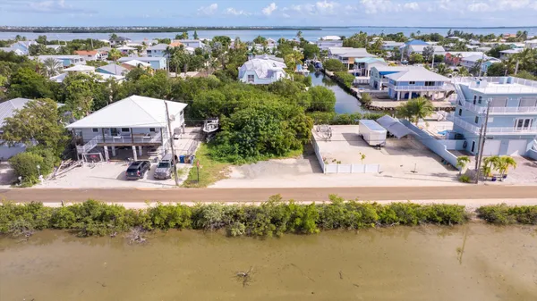 an aerial view of a house with a lake view
