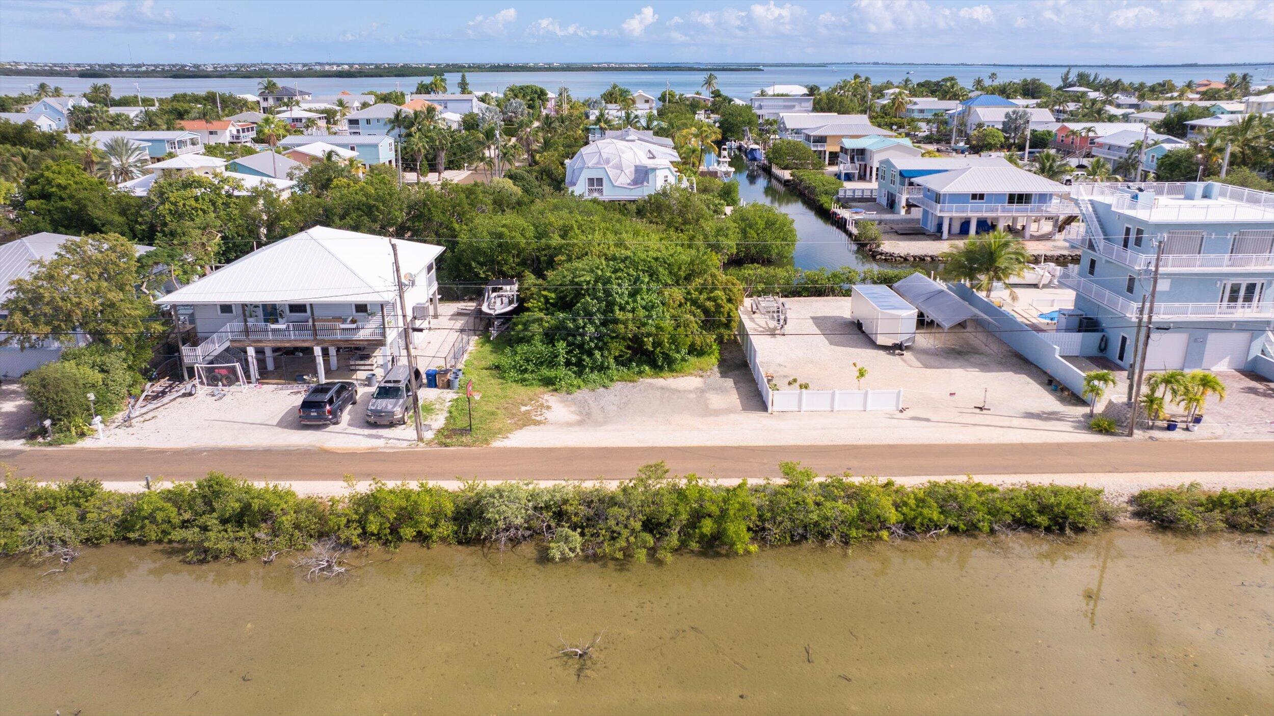 Indies Road Summerland Key, FL 33042 - Photo 2 of 10 an aerial view of a house with a lake view