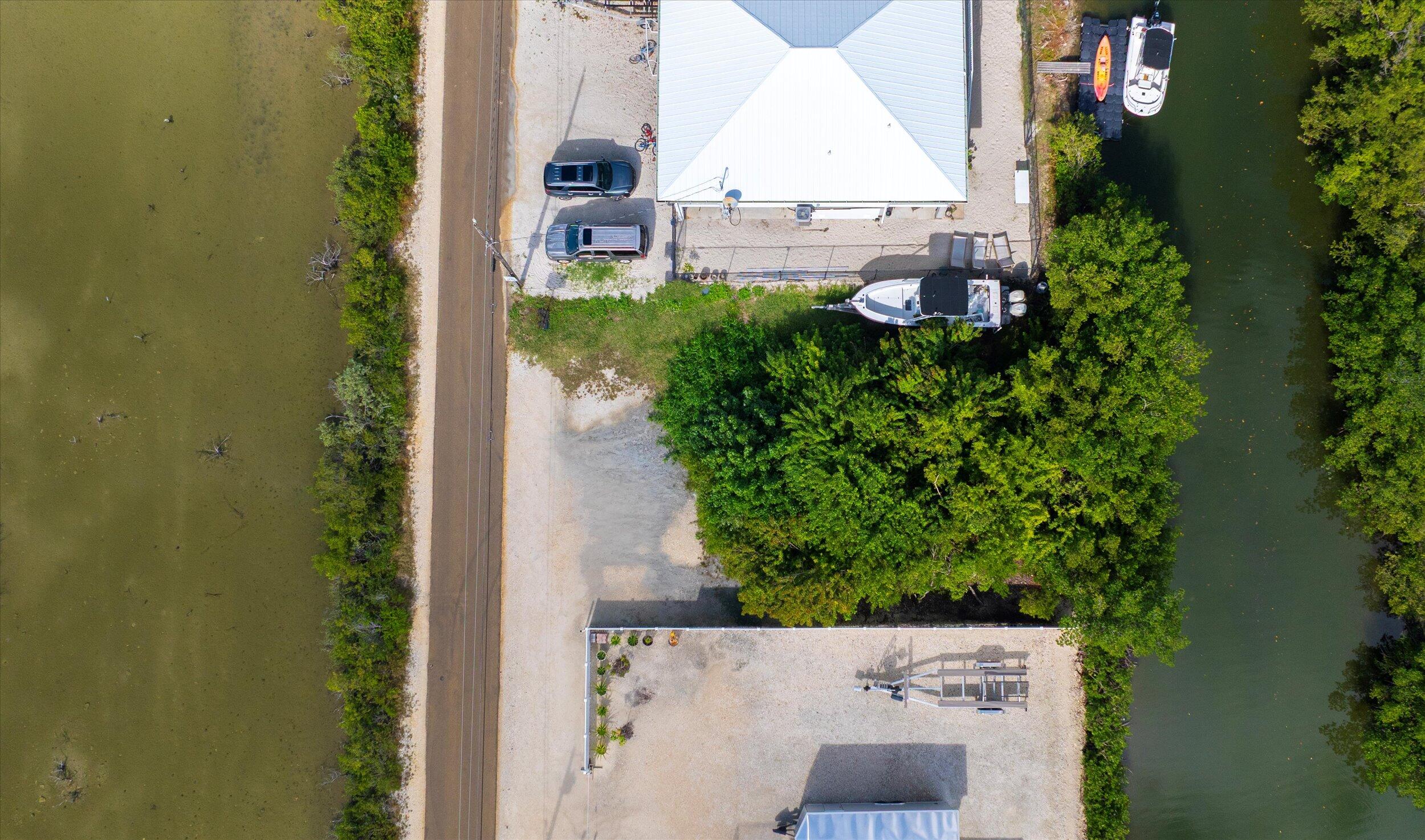 Indies Road Summerland Key, FL 33042 - Photo 4 of 10 an aerial view of a house with a yard