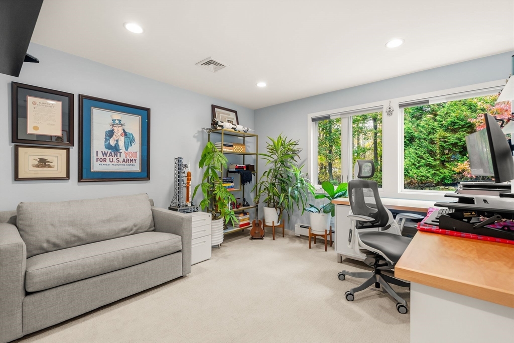 25 Rockwood Road Hingham, MA 02043 - Photo 23 of 32 a living room with furniture and a flat screen tv