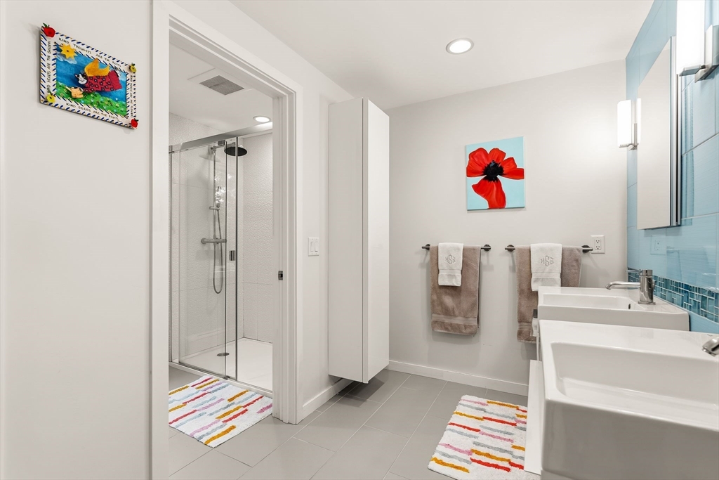 25 Rockwood Road Hingham, MA 02043 - Photo 25 of 32 a kitchen with a sink and a refrigerator