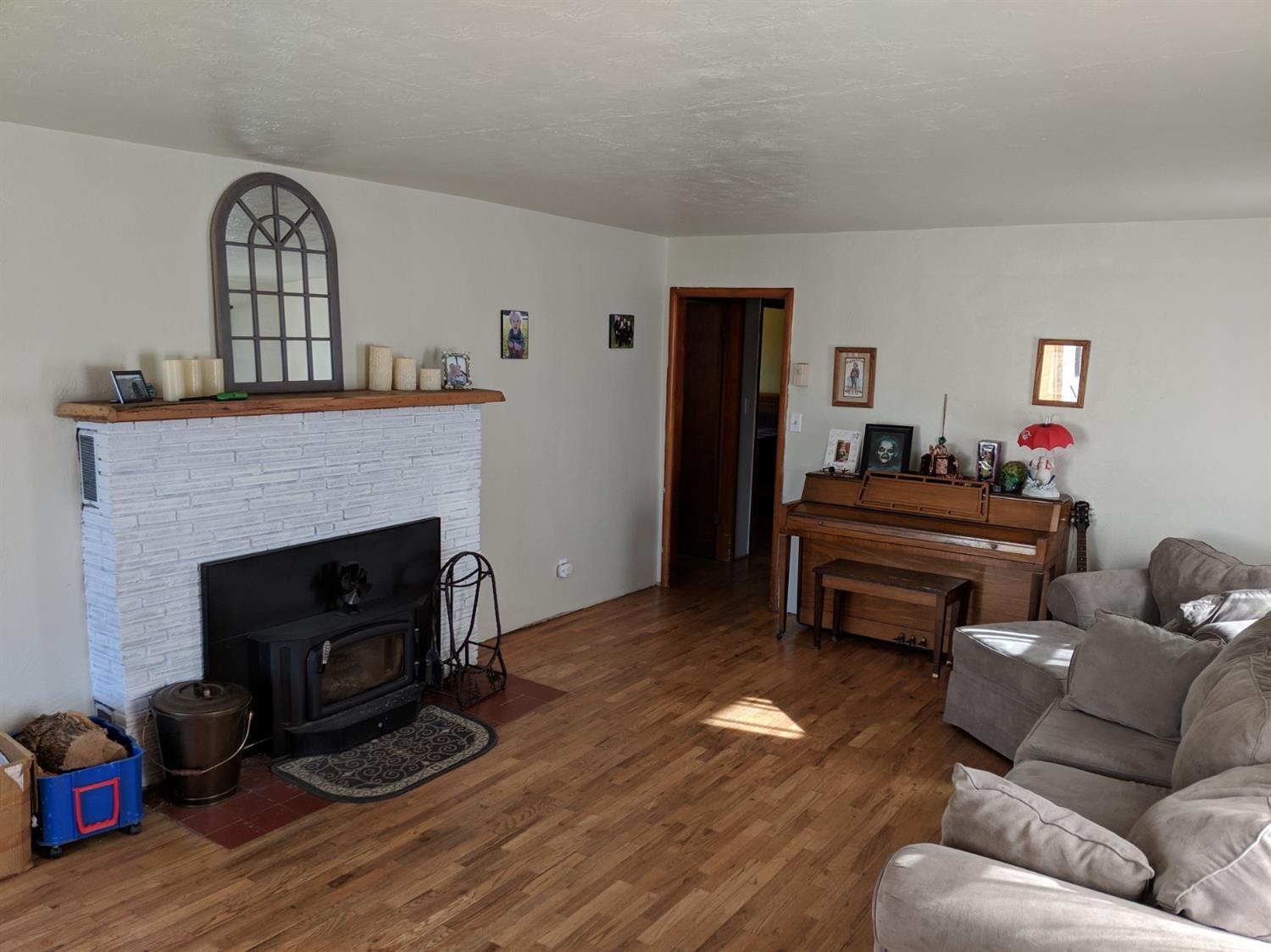 1154 Gibbon Road Central Point, OR 97502 - Photo 2 of 13 a living room with furniture and a fireplace
