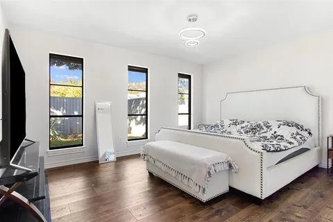 a bathroom with a sink shower and a mirror