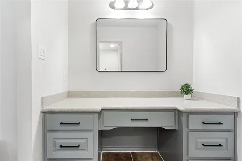 a bedroom with a bed and a chair