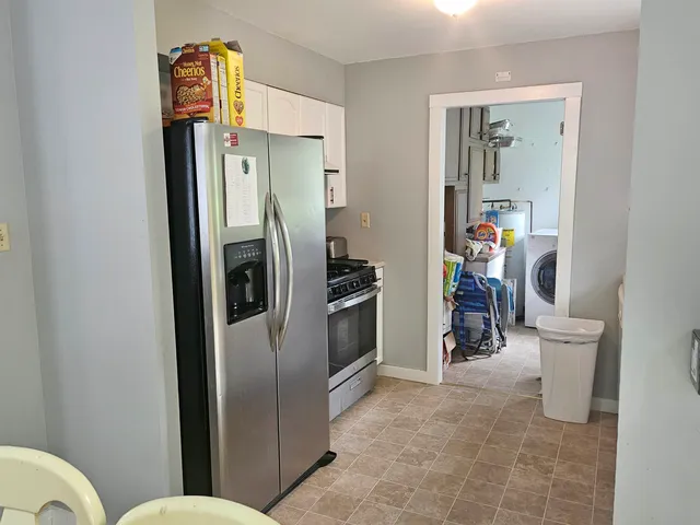 a kitchen with stainless steel appliances a refrigerator and a sink