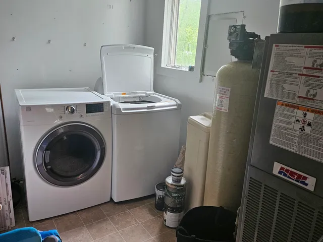 a utility room with dryer and washer