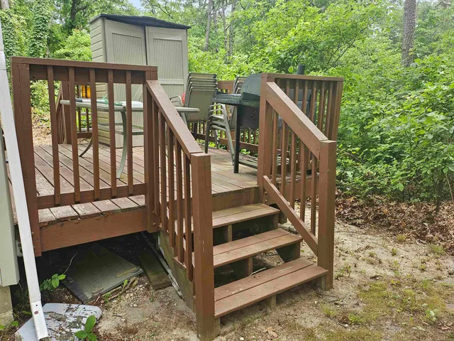 a view of wooden balcony with wooden floor and fence