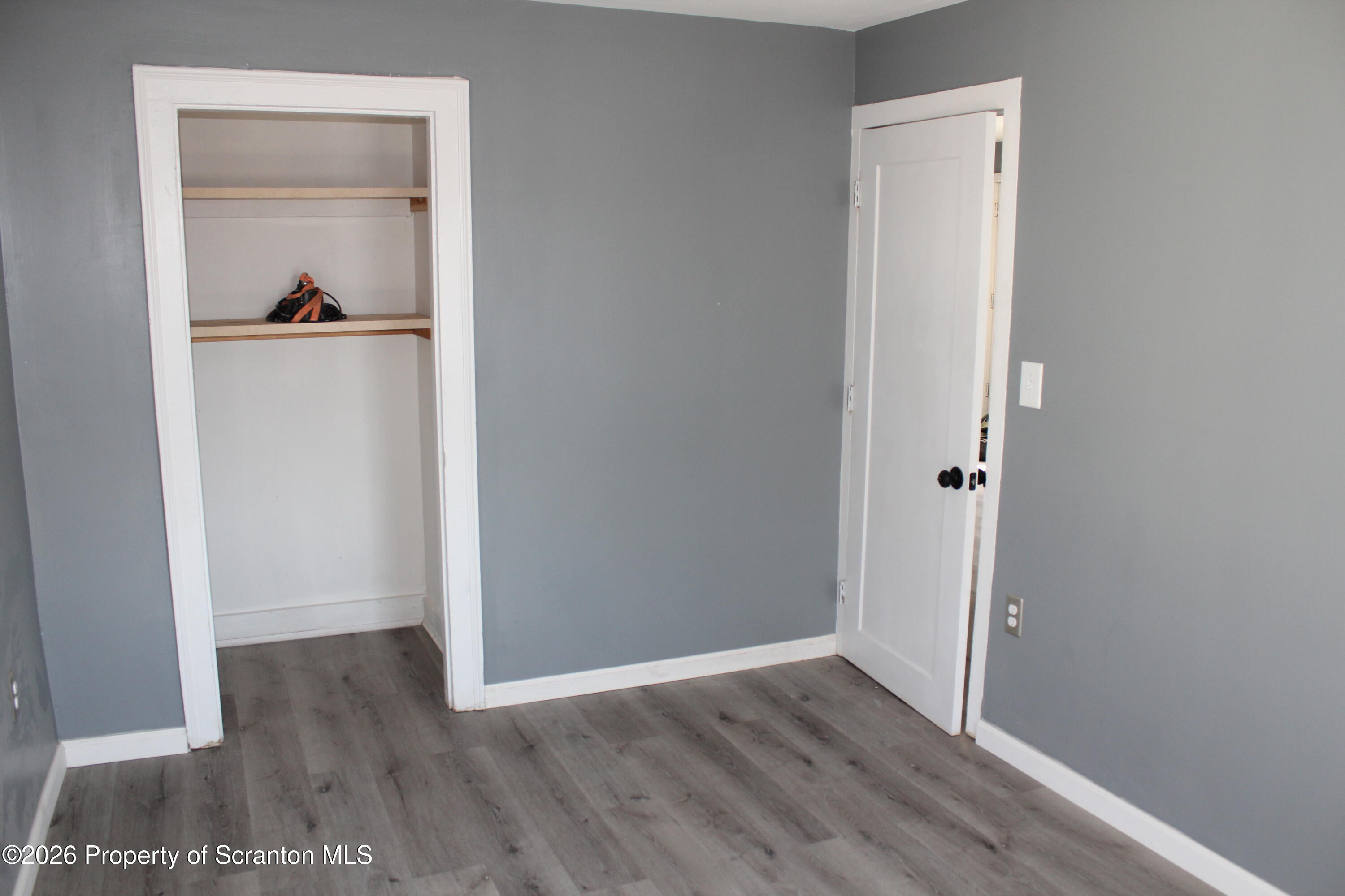 335 Phelps Street, Unit 3 Scranton, PA 18509 - Photo 13 of 15 a view of a hallway with wooden floor