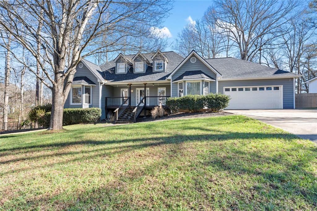 2563 Overlake Drive Powder Springs, GA 30127 - Photo 1 of 1 a front view of house with yard and green space
