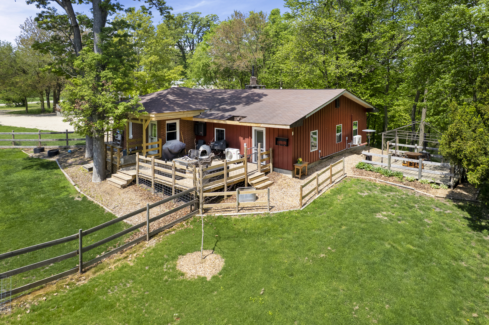 4444 Wesley Freebairn Road Earlville, IL 60518 - Photo 4 of 68 a view of a house with backyard porch and sitting area