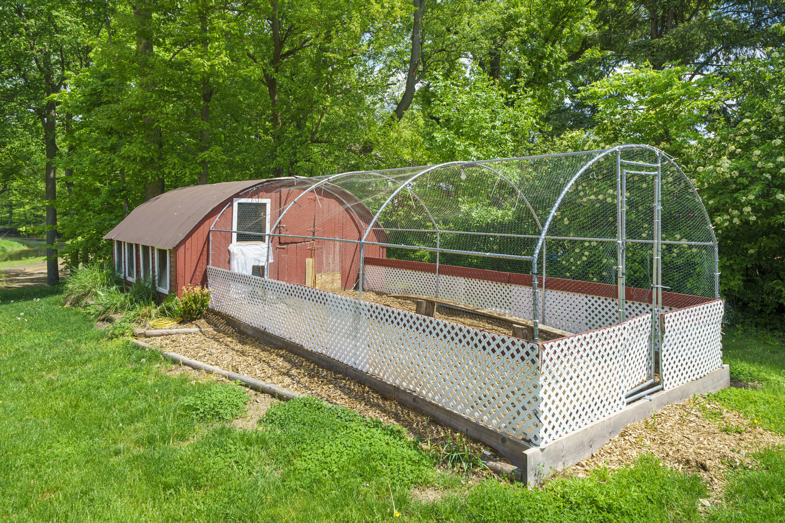 4444 Wesley Freebairn Road Earlville, IL 60518 - Photo 46 of 68 a view of a wooden deck and a backyard with a small garden