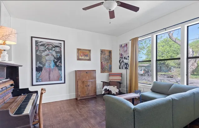 a living room with furniture and a large window