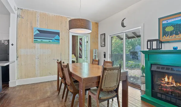 a living room with wooden floors and furniture