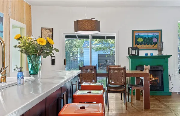a room with furniture and a potted plant