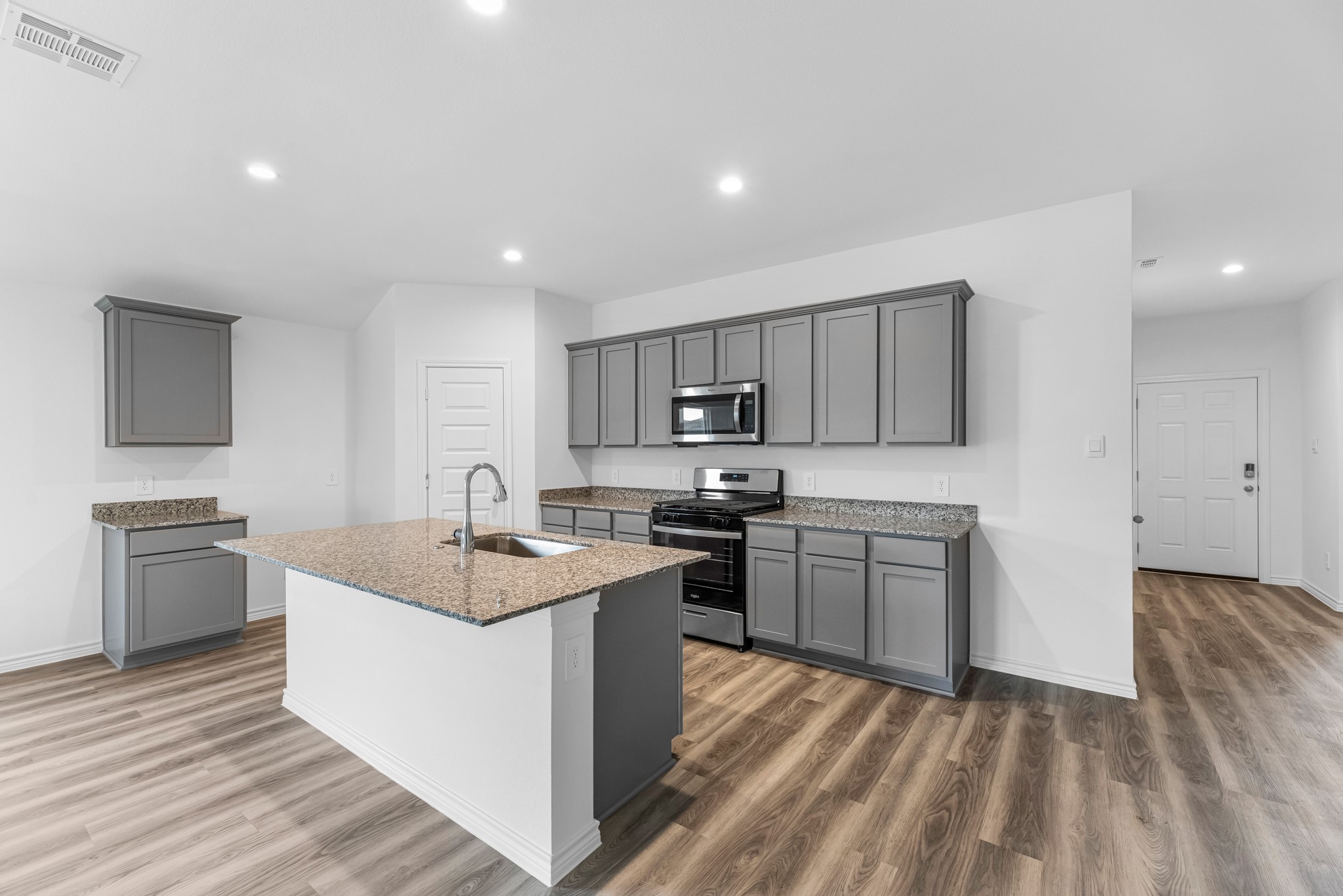 5680 Spoonbill Orange, TX 77632 - Photo 2 of 23 a kitchen with a sink stove top oven and refrigerator