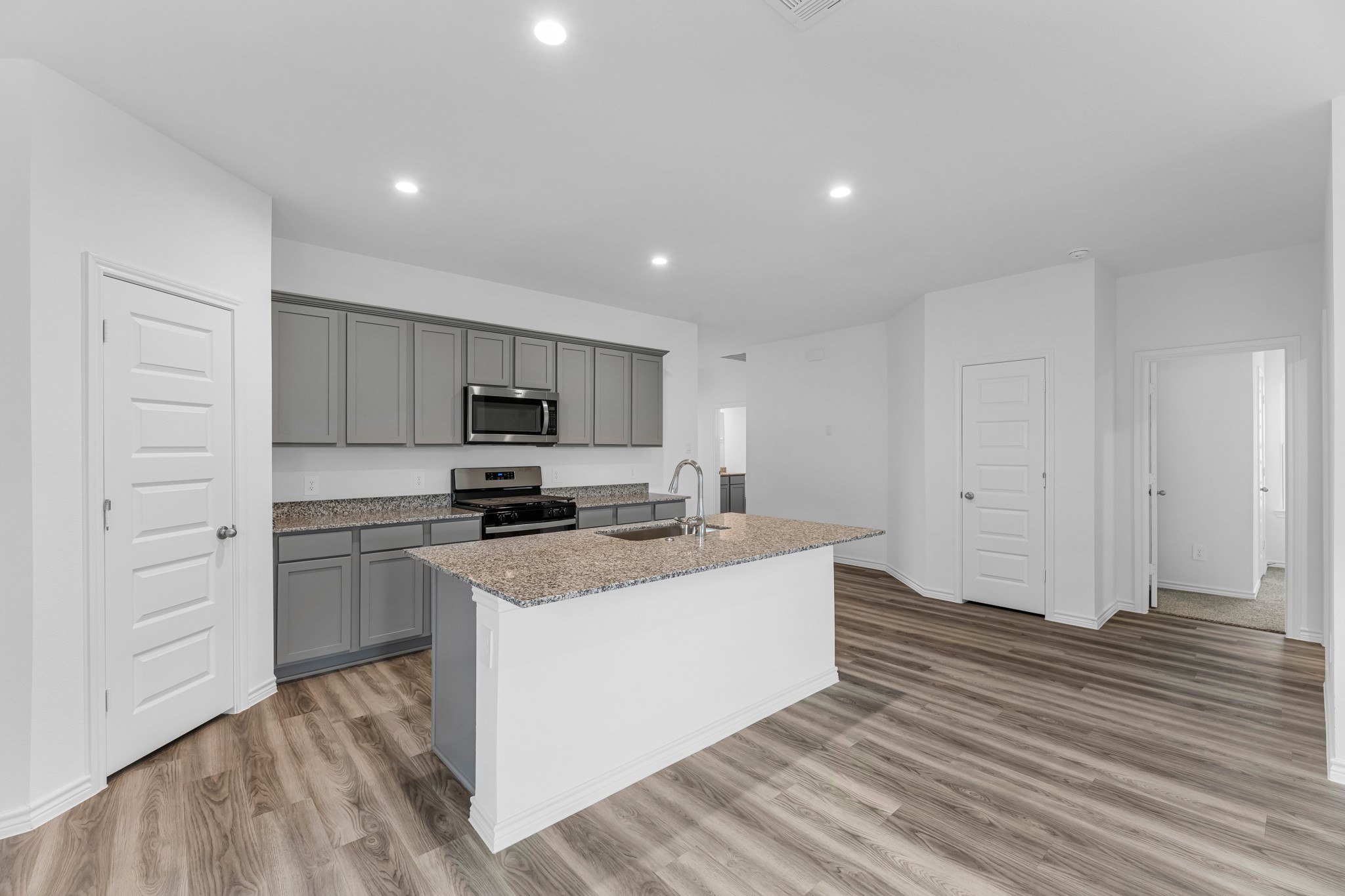 5680 Spoonbill Orange, TX 77632 - Photo 4 of 23 a kitchen with a sink a stove and cabinets