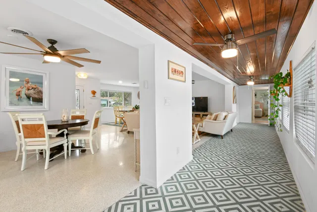 a kitchen with a stove a table and chairs