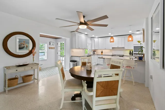 a kitchen with granite countertop a sink stove and cabinets