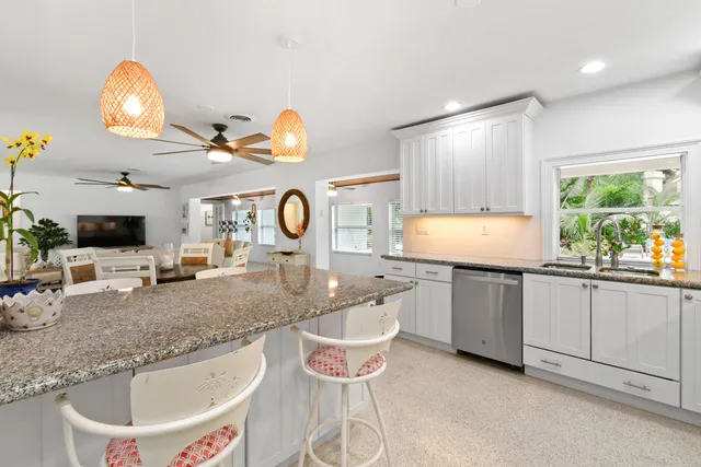 a kitchen with a refrigerator and a sink