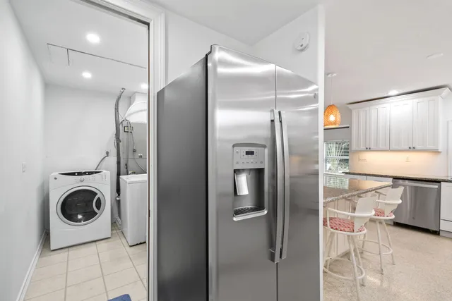 a bathroom with a sink a toilet a mirror and shower