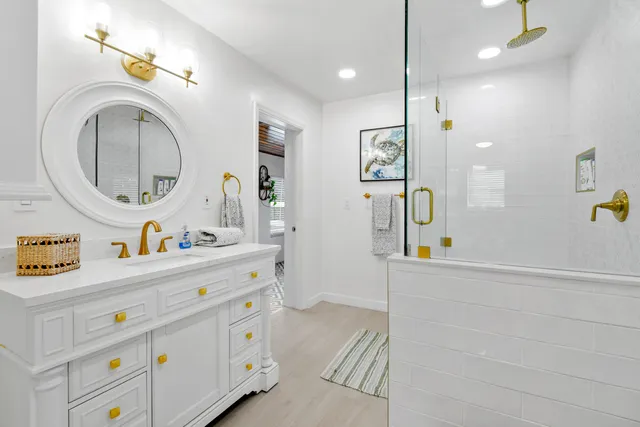 a room with a bed and a mirror