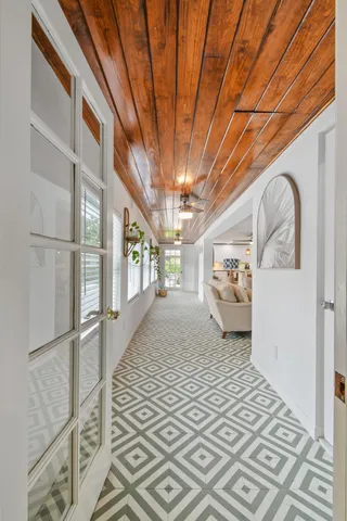 a bedroom with a bed a couch and a flat screen tv