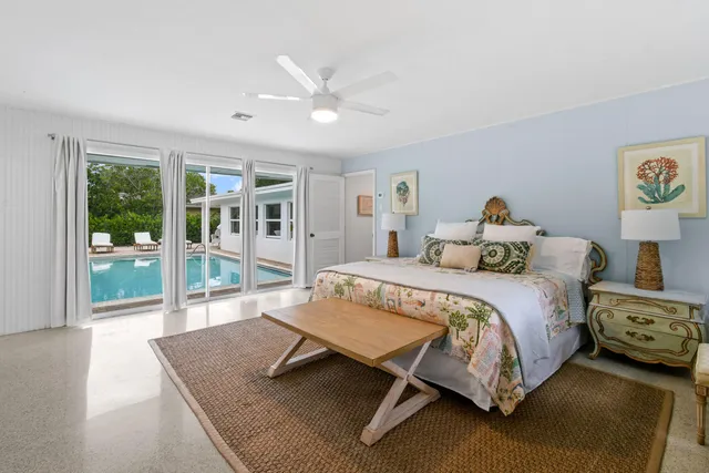 a view of a house with backyard sitting area and garden