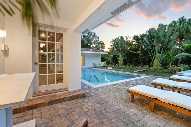a view of a swimming pool with a patio