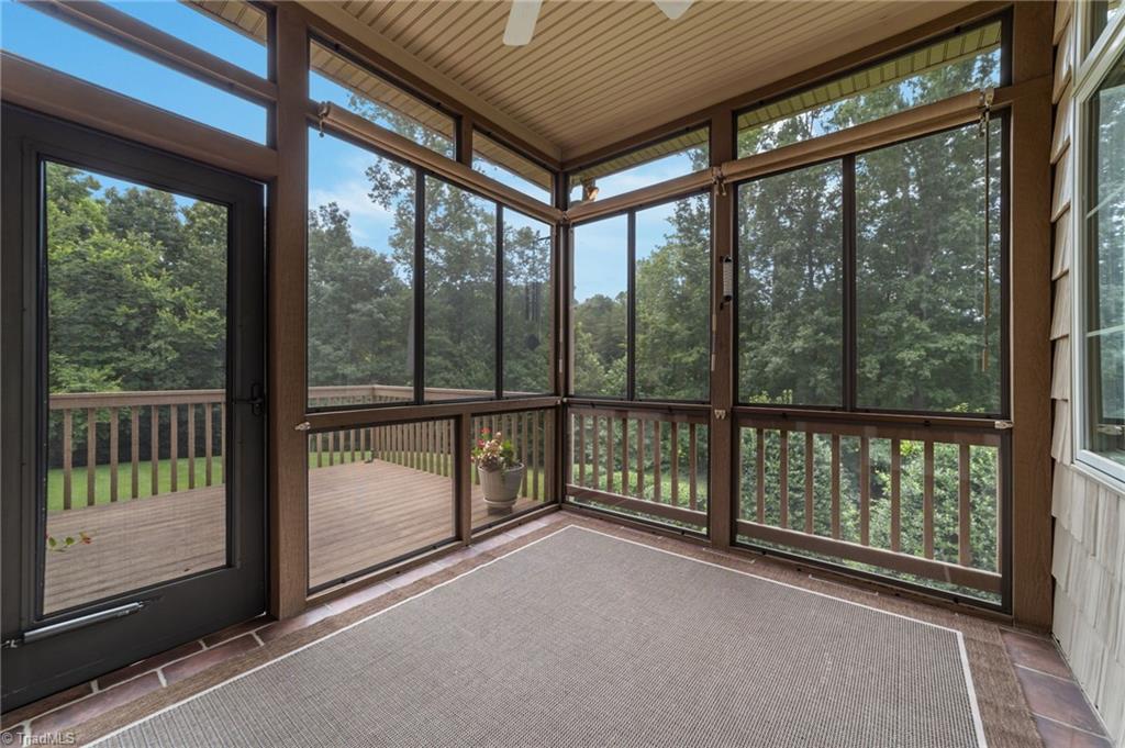 7911 Quiet Place Oak Ridge, NC 27310 - Photo 11 of 46 Easy breeze porch