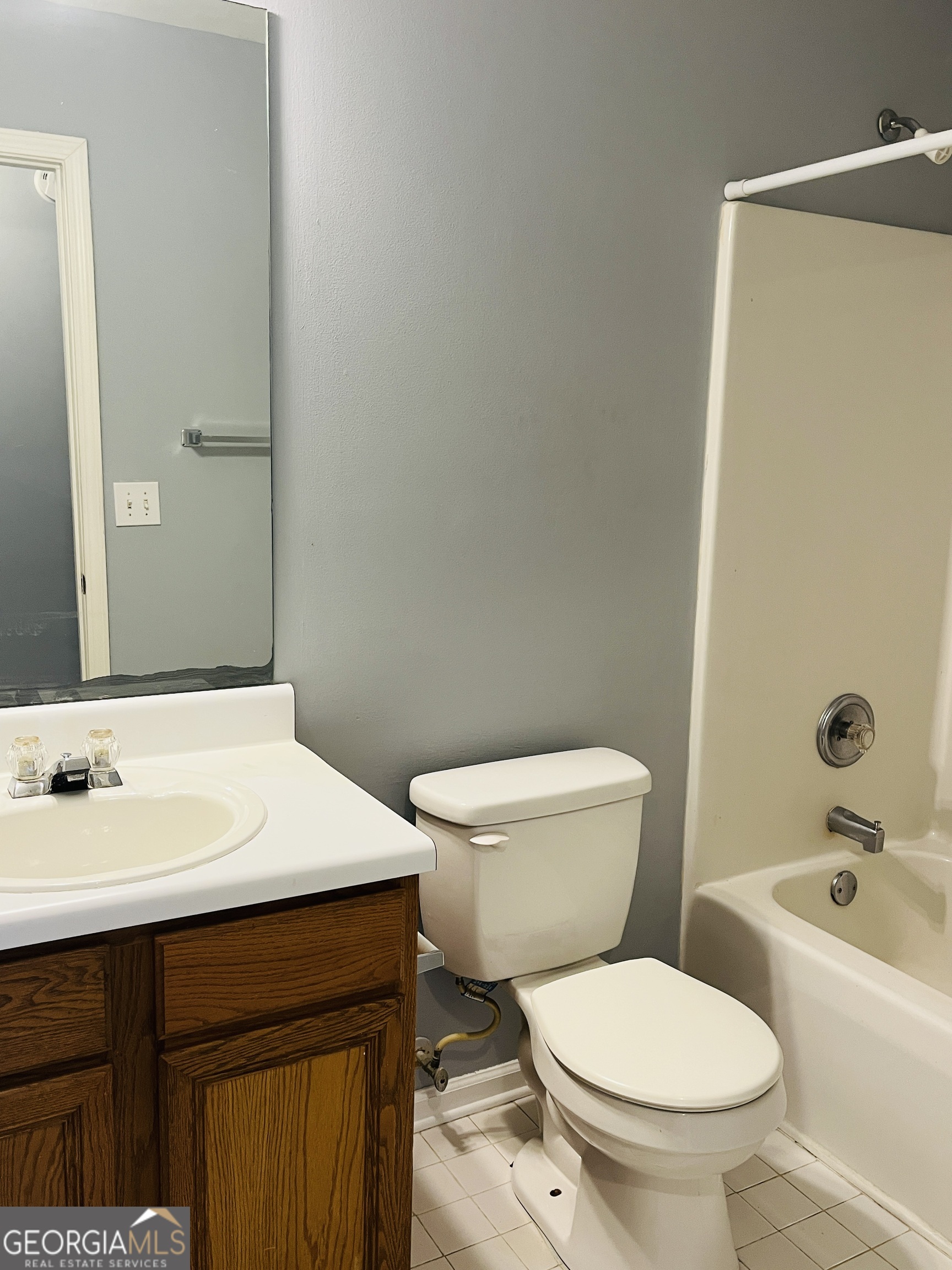 405 Peeks Crossing Drive Senoia, GA 30276 - Photo 18 of 31 a bathroom with a sink a toilet and shower