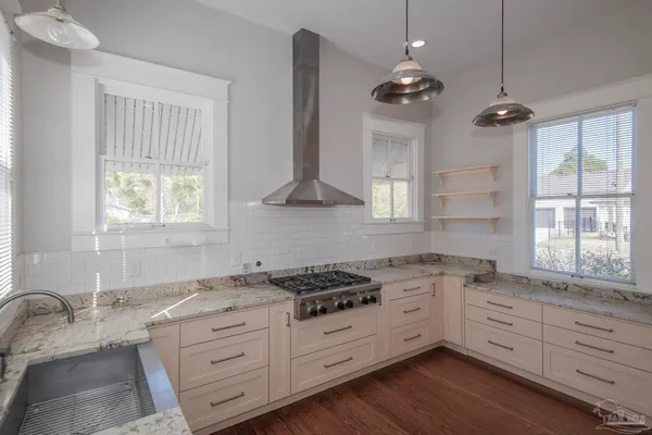a kitchen with a stove and a sink