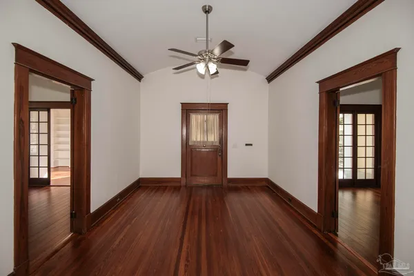 wooden floor in an empty room with a window