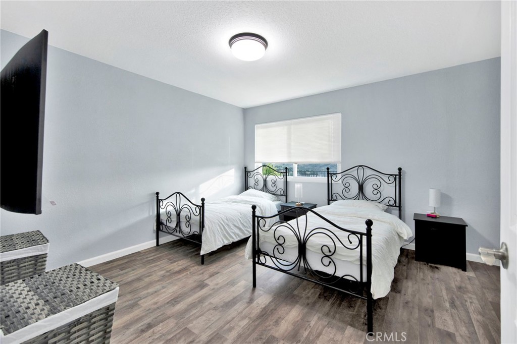 31511 Indian Oak Road Acton, CA 93510 - Photo 11 of 32 a bedroom with two beds and a couch