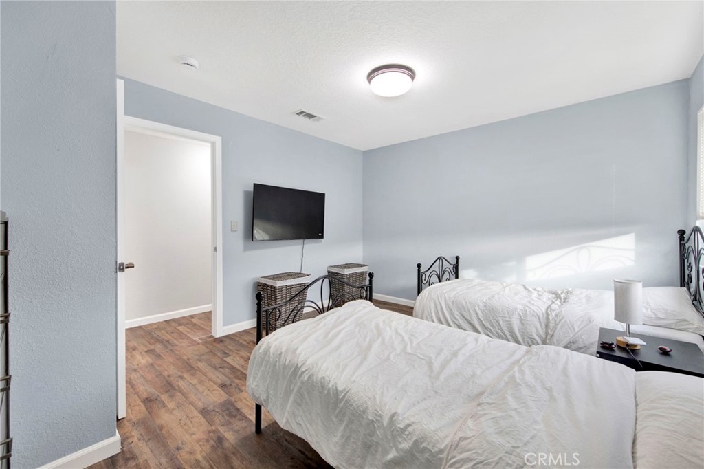 31511 Indian Oak Road Acton, CA 93510 - Photo 12 of 32 a bedroom with two bed and a flat screen tv