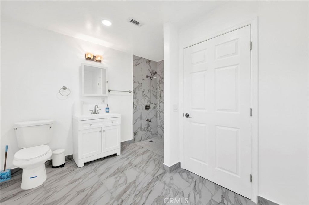 31511 Indian Oak Road Acton, CA 93510 - Photo 15 of 32 a bathroom with a sink a toilet and shower